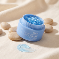 Hydra Capsule Cream open jar with capsules on linen