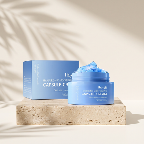 Hydra Capsule Cream jar and box on travertine pedestal